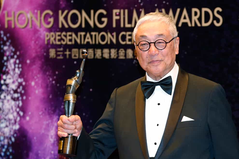 Hong Kong actor Kenneth Tsang poses after winning the Best Supporting Actor award for his movie Overhead 3 during the Hong Kong Film Awards (Kin Cheung/AP)