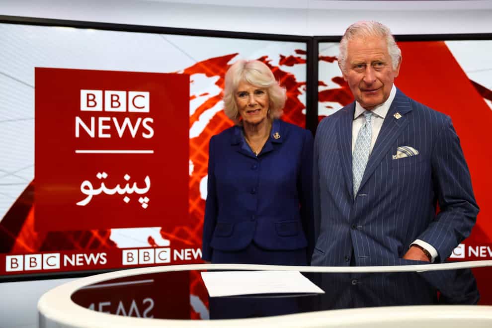 The Prince of Wales and the Duchess of Cornwall in a TV studio during a visit to BBC World Service in London (PA)