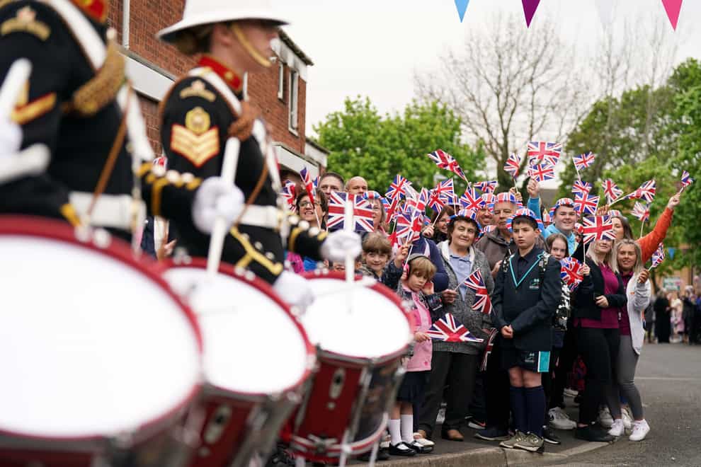 The Royal Marines Band surprise residents of Church Hill in Redditch, near Birmingham, as they play a medley of tunes to celebrate Queen Elizabeth’s Platinum Jubilee (Jacob King/PA)