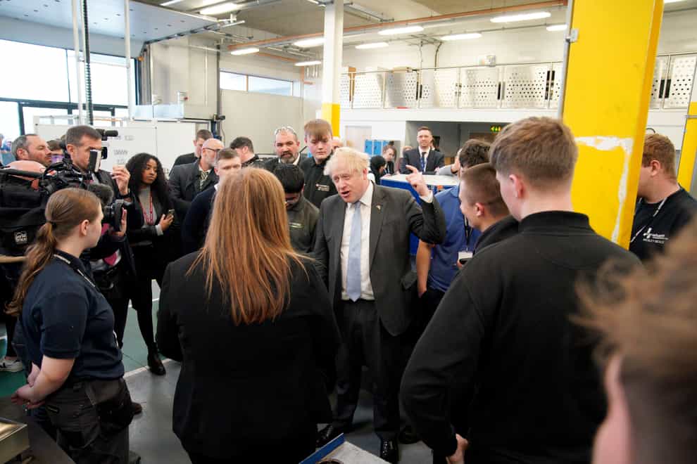 Prime Minister Boris Johnson meets students during a campaign visit to Burnley College (Peter Byrne/PA)