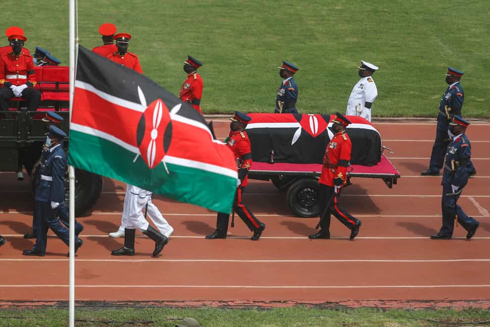 A military honour guard walks with the coffin of Kenya’s former president Mwai Kibaki (Brian Inganga/AP)
