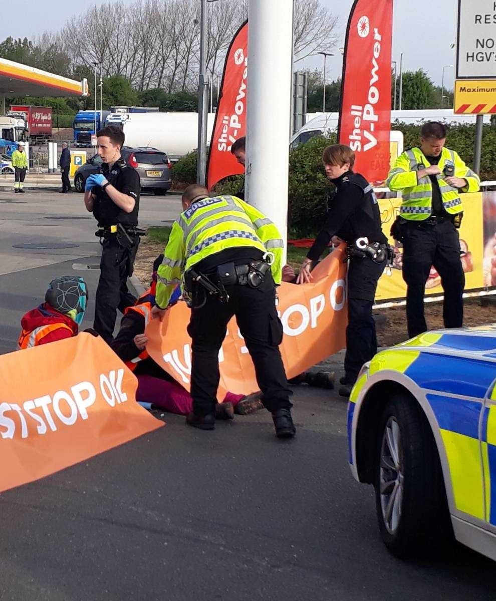 Just Stop Oil of campaigners stage a protest in the Shell petrol garage at the Cobham Services on the M25 in Cobham, Surrey (PA)