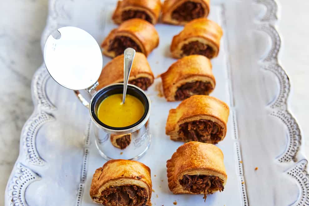 Seswaa and English mustard ‘sausage’ rolls from The Platinum Jubilee Cookbook (David Loftus/PA)