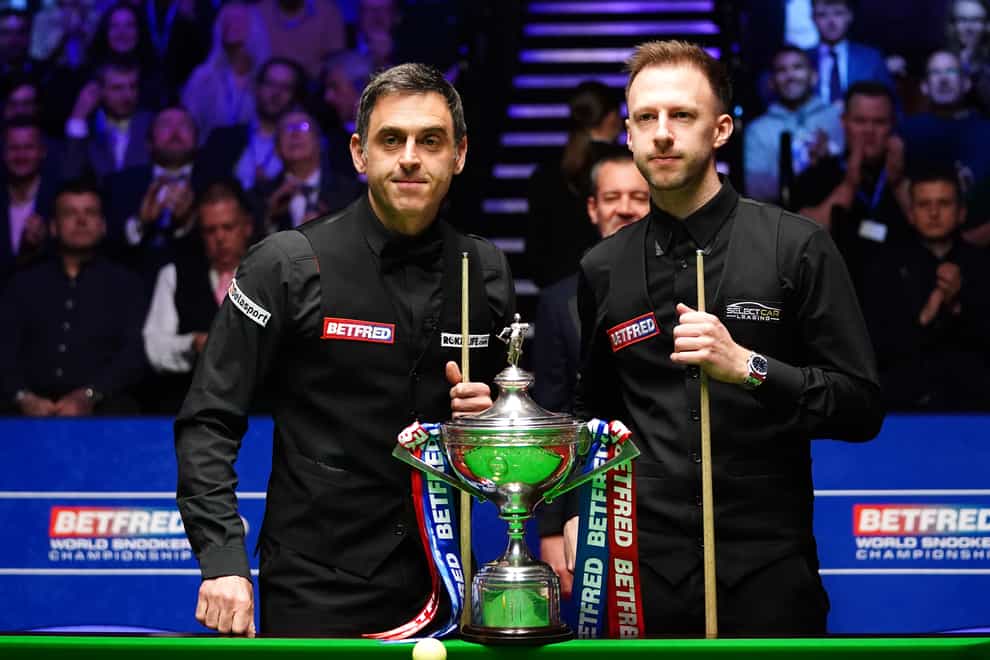 Ronnie O’Sullivan leads Judd Trump after the opening session of their World Snooker Championship final (Zac Goodwin/PA)