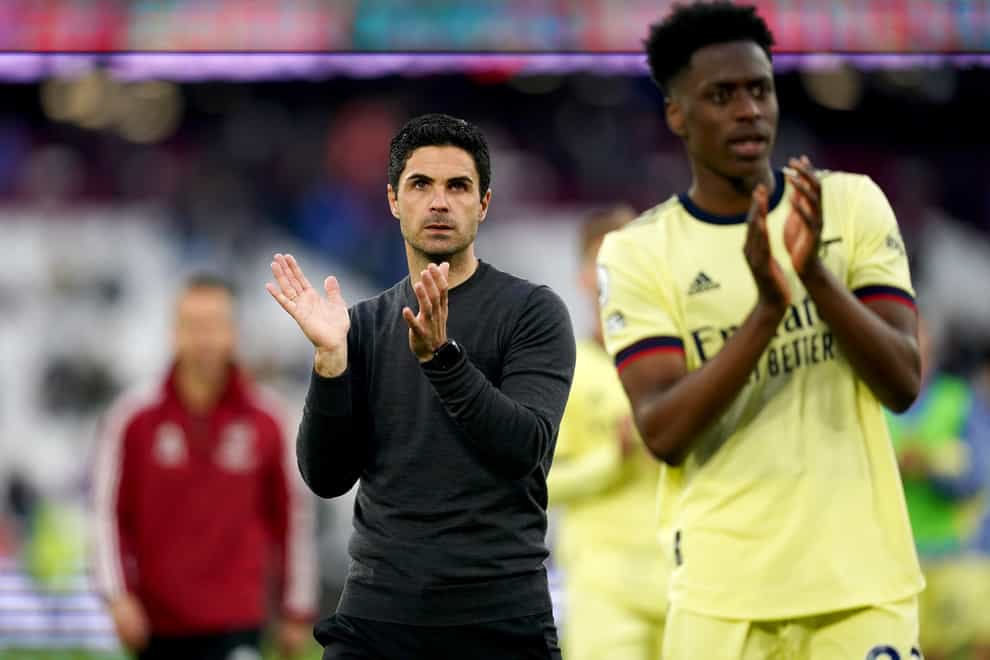 Mikel Arteta and his team applaud the fans at full-time (John Walton/PA)