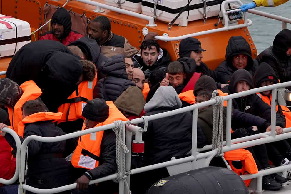 A group of people thought to be migrants are brought in to Dover, Kent, onboard the Dover Lifeboat following a small boat incident in the Channel (Gareth Fuller/PA)