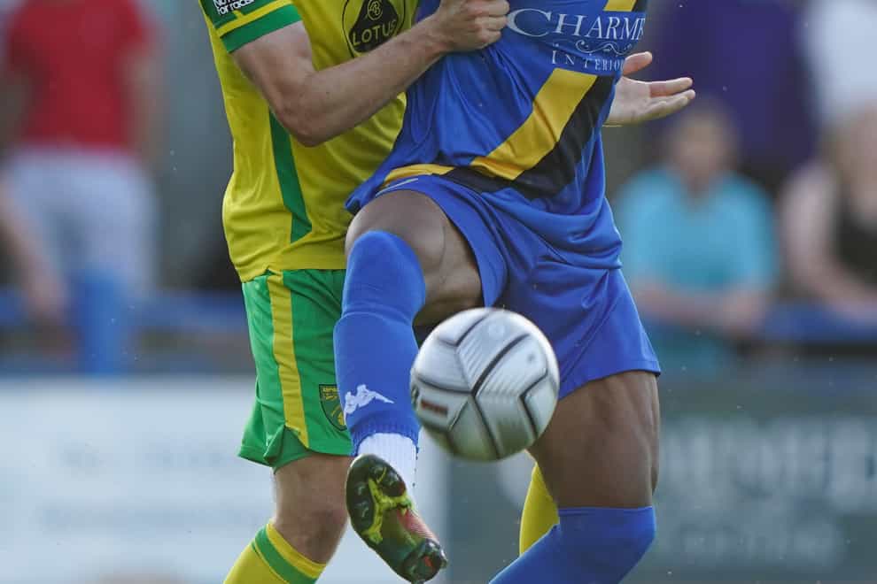 Kings Lynn’s Gold Omotayo (right) opened the scoring in a 3-0 National League win at Woking (Joe Giddens/PA)