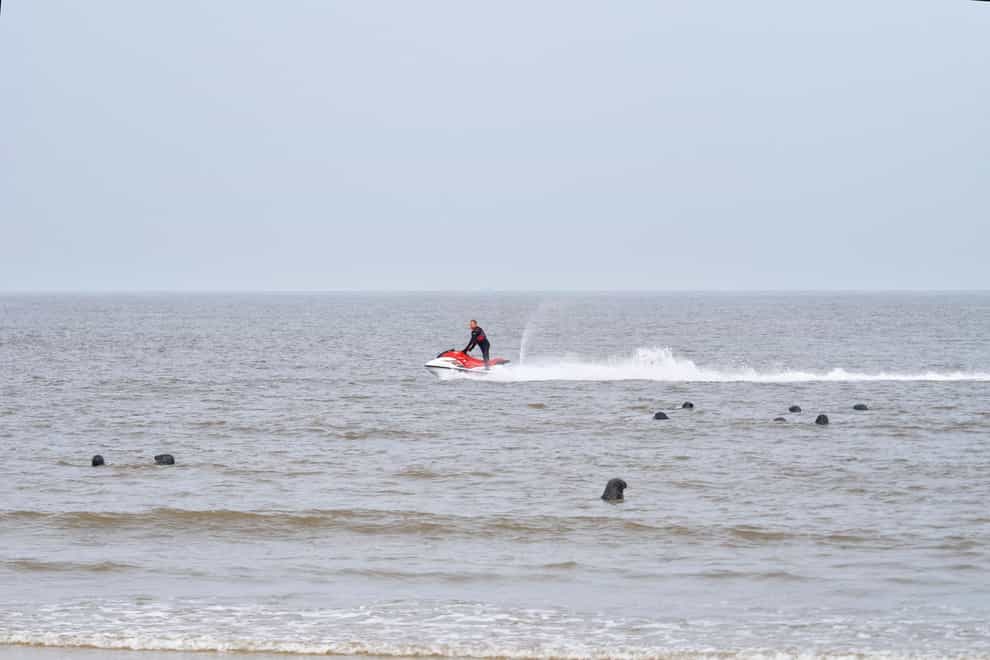 Friends of Horsey Seals has criticised jet-skiers for ‘harassing’ a group of seals close to the shoreline at Horsey Beach in Norfolk (Roger Parrish/PA)