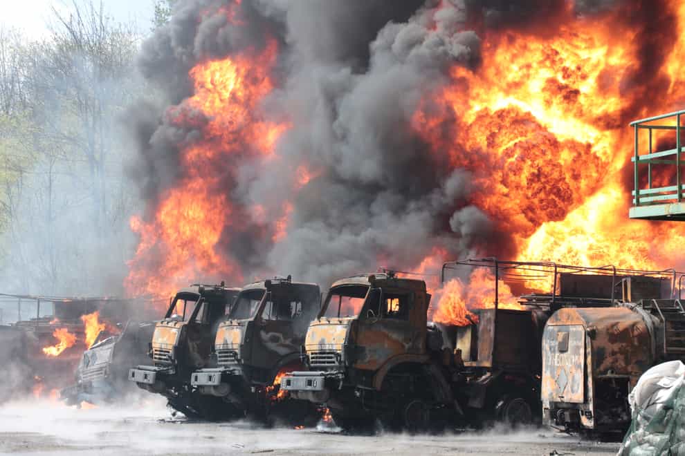 Vehicles on fire at an oil depot after missiles struck the facility in an area controlled by Russian-backed separatist forces in Makiivka, Ukraine, on Wednesday May 4 2022 (AP)