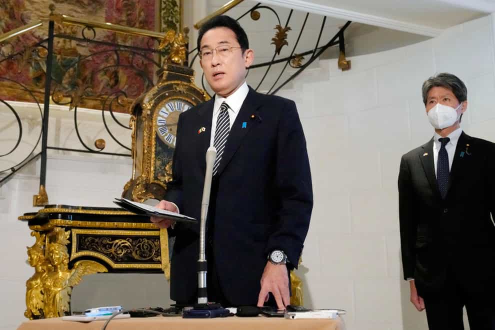 Japan’s Prime Minister Fumio Kishida, centre, speaks to reporters after North Korea fired a ballistic missile amid rising animosities (Sadayuki Goto/Kyodo News/AP)