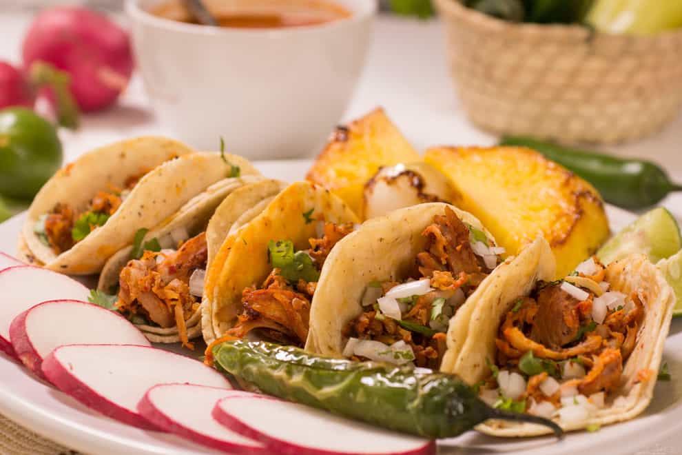 Tacos, fajitas and enchiladas are all popular Mexican classics (Alamy/PA)