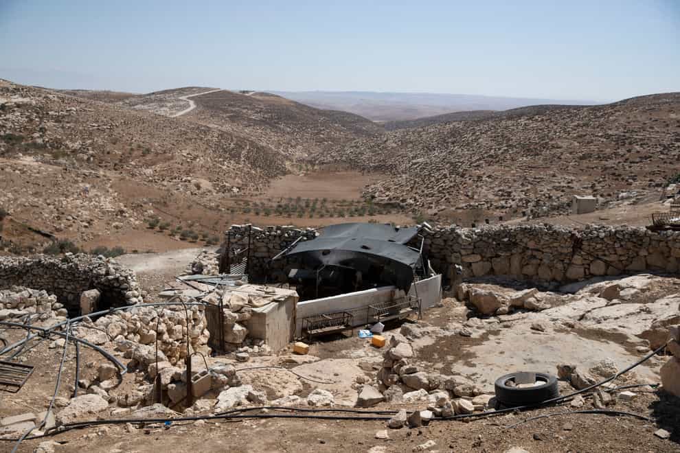 A stockyard that suffered damage following a settlers’ attack from nearby settlement outposts on the Bedouin community, in the West Bank village of al-Mufagara, near Hebron, in September 2021 (Nasser Nasser/AP)