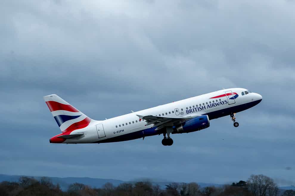 British Airways’ parent company recorded a heavy loss for the first three months of the year as the Omicron variant reduced passenger numbers (Peter Byrne/PA)