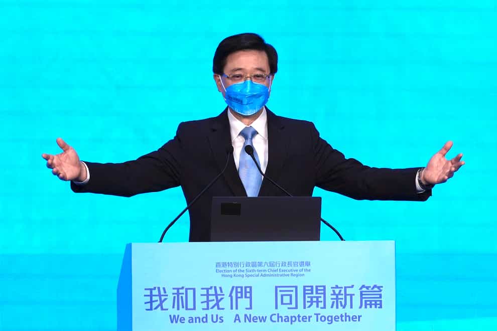 John Lee attends his 2022 chief executive electoral campaign rally in Hong Kong (Kin Cheung/AP)