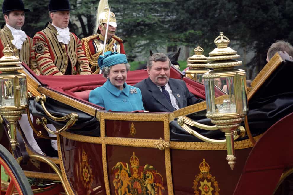 The Queen with the then president of Poland, Lech Walesa, ride to Windsor Castle in a state landau at the start of his visit to Britain (Martin Keene/PA)