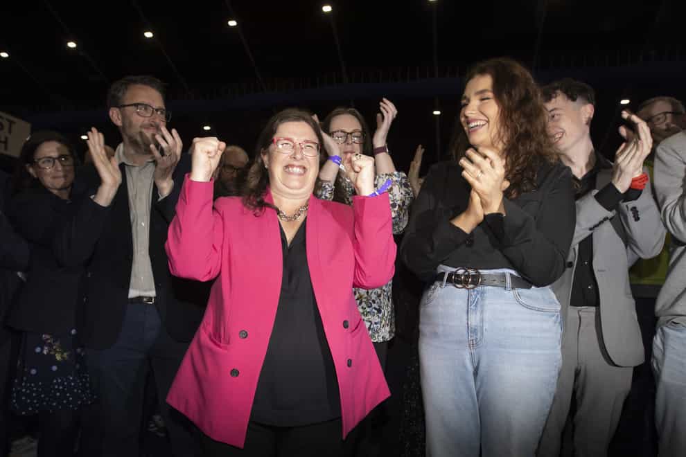 Kellie Armstrong celebrates with supporters (Liam McBurney/PA)