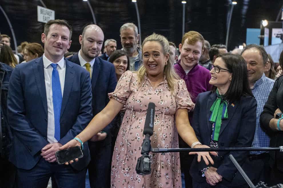 Alliance Party of NI Assembly candidate Kate Nicholl (centre) with her husband Fergal Sherry (centre left) and supporters (Liam McBurney/PA)
