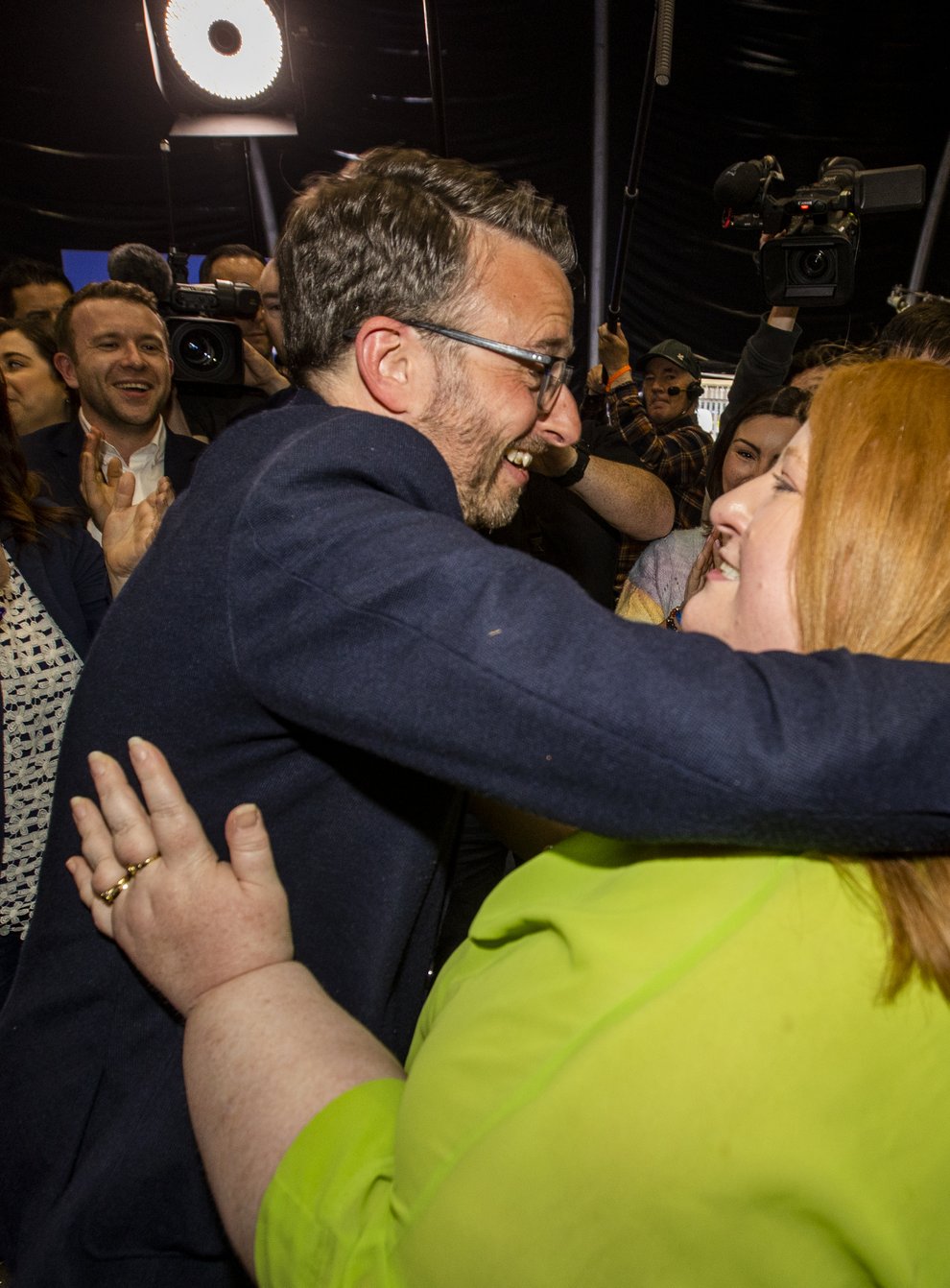 Alliance Party leader Naomi Long celebrates with her newly-elected party colleague Nick Mathison (Liam McBurney/PA)