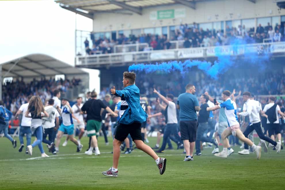 Fans invaded the pitch after Bristol Rovers scored their seventh goal (Bradley Collyer/PA).