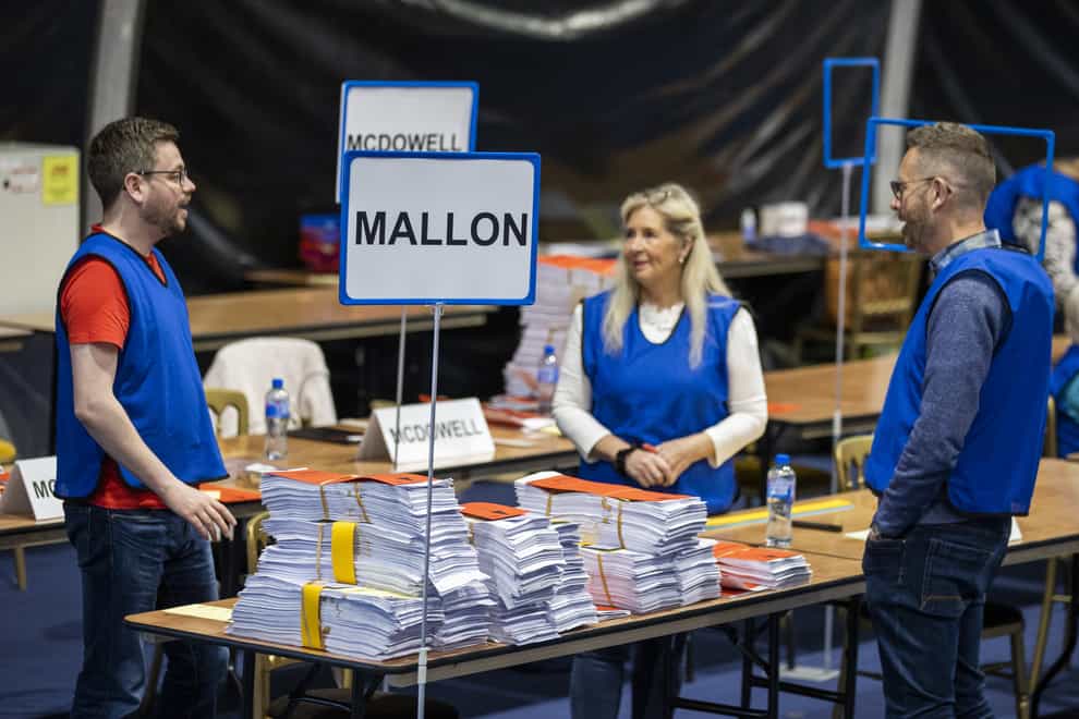 Talliers stand beside the ballots of SDLP Assembly candidate Nichola Mallon (PA)