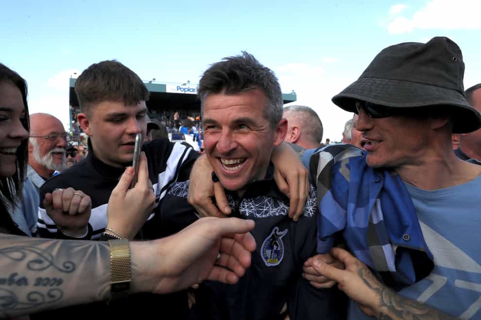 Bristol Rovers manager Joey Barton is mobbed by celebrating fans (Bradley Collyer/PA).
