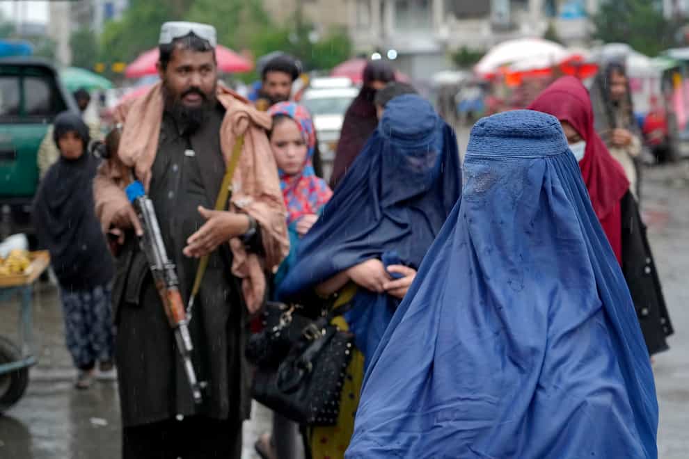 Women walk through the old market in Kabul (Ebrahim Noroozi/AP)