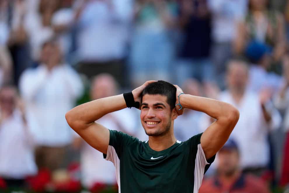 Carlos Alcaraz celebrates after defeating Novak Djokovic (Manu Fernandez/AP)