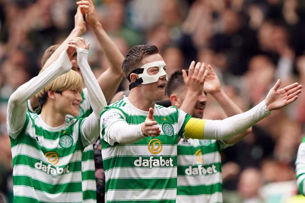 Celtic players salute their fans (Andrew Milligan/PA)