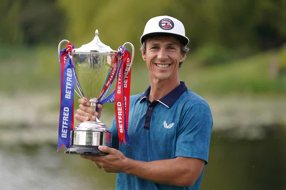 Denmark’s Thorbjorn Olesen celebrates with the trophy after winning the Betfred British Masters (Zac Goodwin/PA)