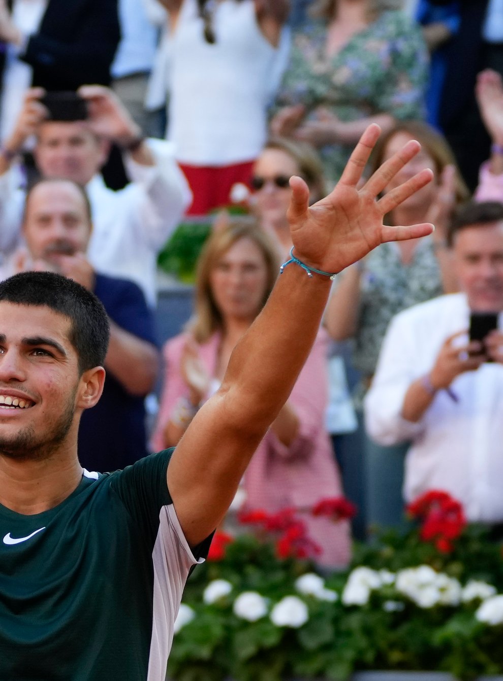 Carlos Alcaraz celebrates after defeating Alexander Zverev in the Madrid Open final (Paul White/AP)