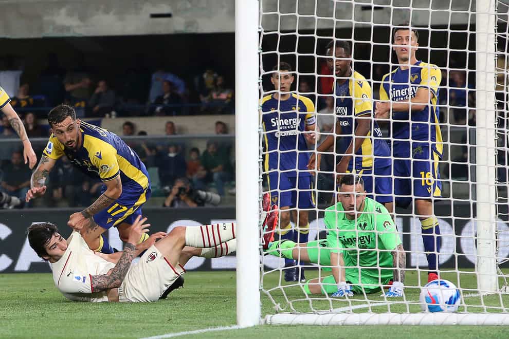 Sandro Tonal, bottom left, scores AC Milan’s equaliser in their 3-1 win at Verona (Paola Garbuio/AP)