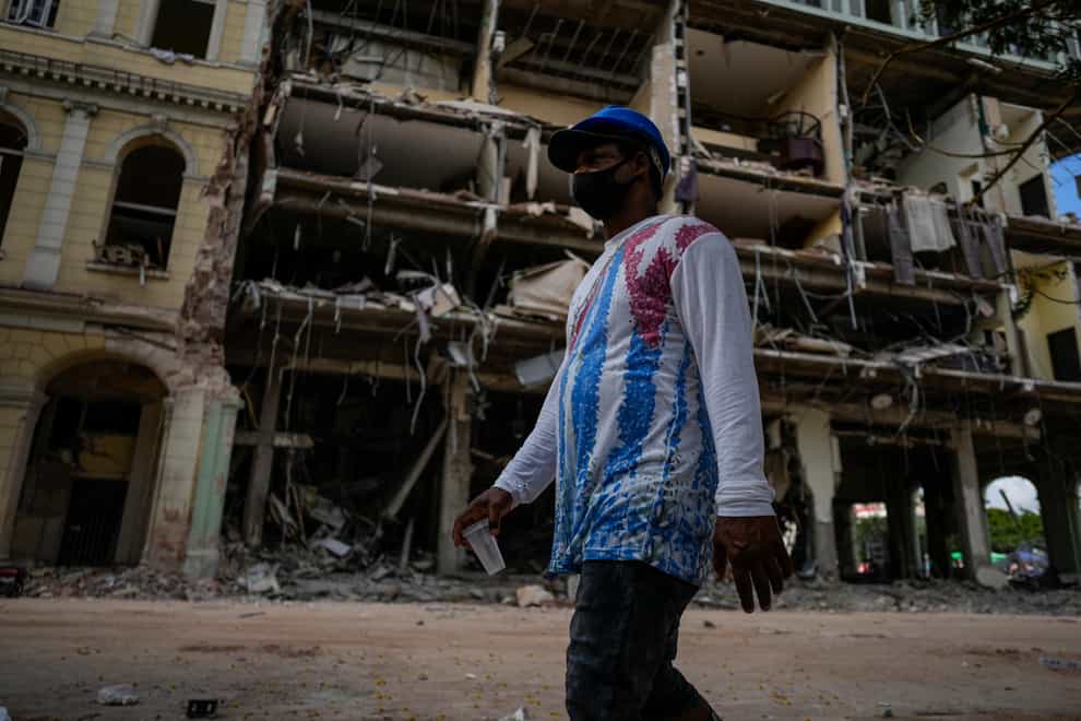 The death toll of a powerful explosion at a luxury hotel in Cuba’s capital increased to 31 as search crews with dogs continued looking for people still missing (Ramon Espinosa/AP)