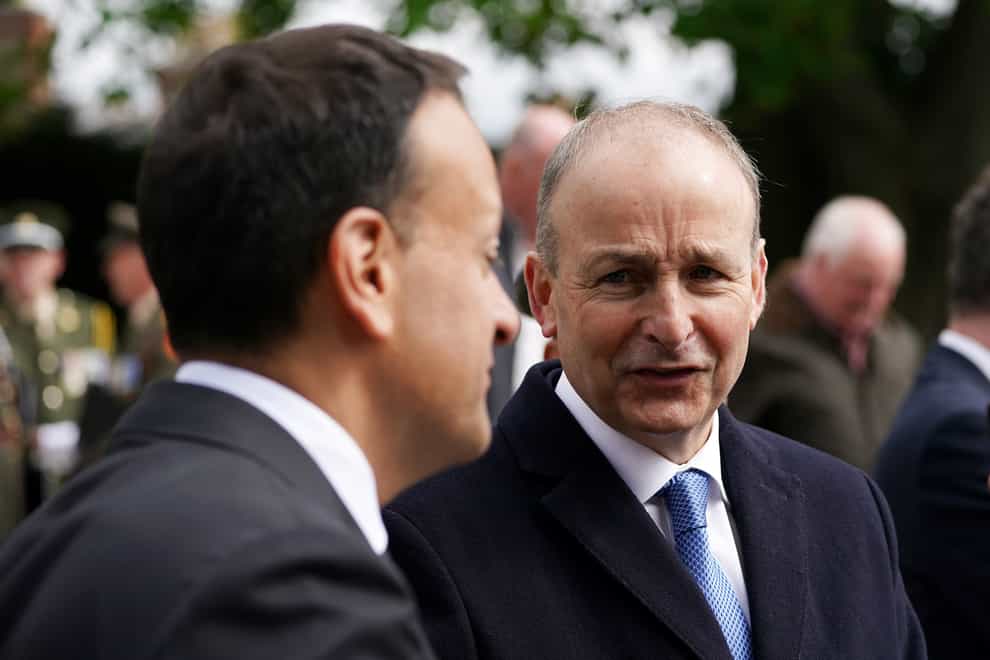 Taoiseach Micheal Martin (right) in conversation with Tanaiste Leo Varadkar following a state religious ceremony to commemorate the 1916 Easter Rising leaders at Arbour Hill Cemetery in Dublin (Brian Lawless/PA)
