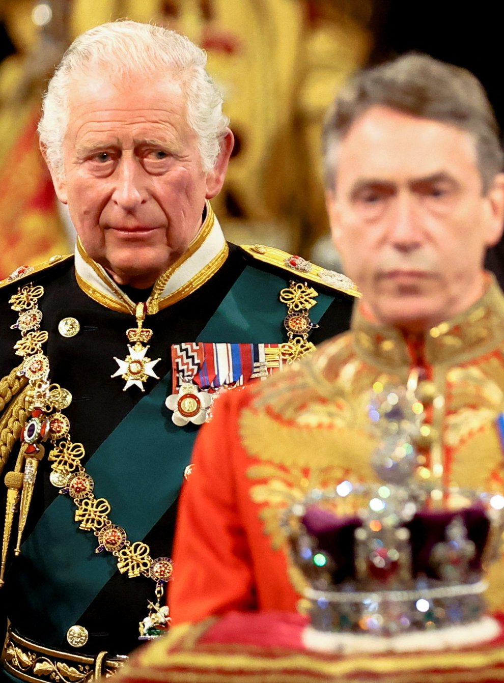 The Prince of Wales proceeds behind the Imperial State Crown through the Royal Gallery during the State Opening of Parliament in the House of Lords, London (Hannah McKay/PA)