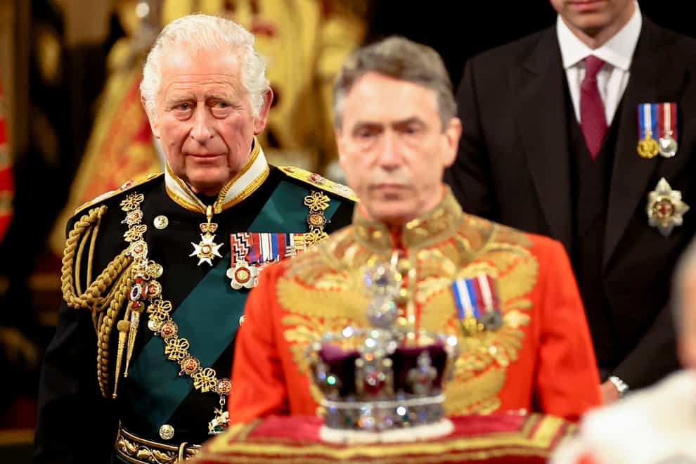 The Prince of Wales proceeds behind the Imperial State Crown through the Royal Gallery during the State Opening of Parliament in the House of Lords, London (Hannah McKay/PA)
