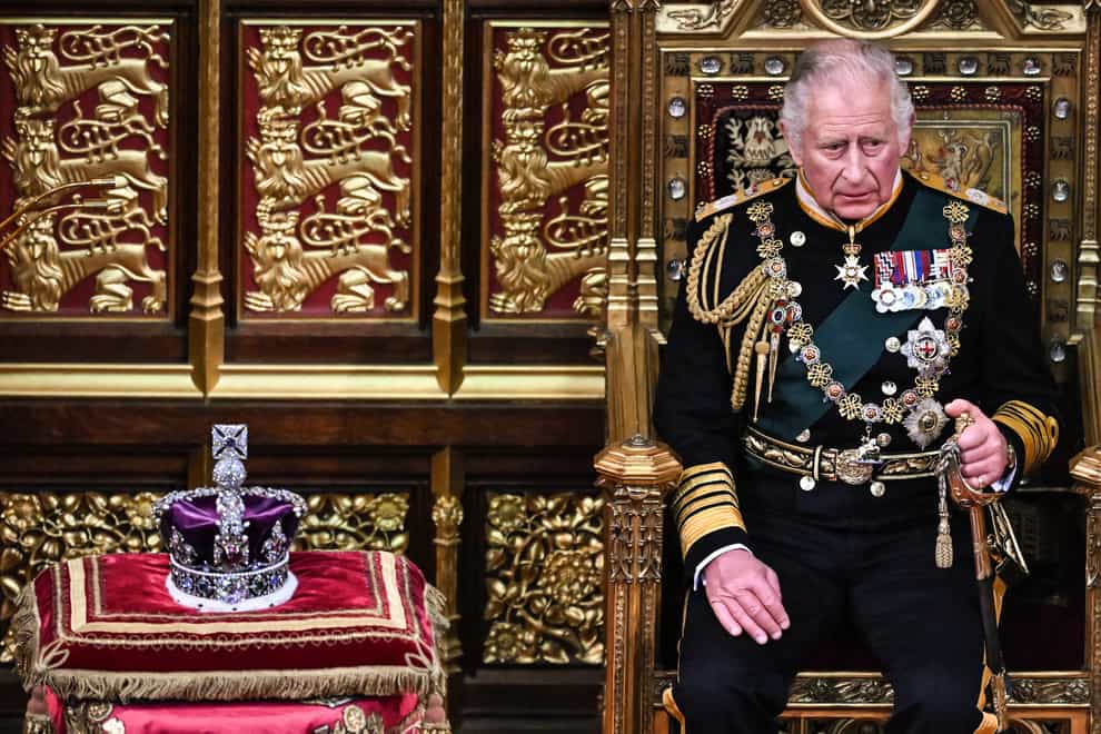 The Prince of Wales sits by the Imperial State Crown during the State Opening of Parliament in the House of Lords, London (Ben Stansall).