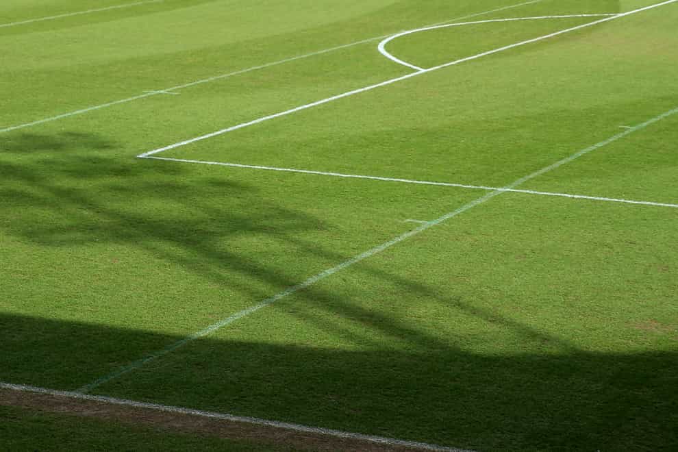 The shadow of a floodlight on the pitch at the Keepmoat Stadium