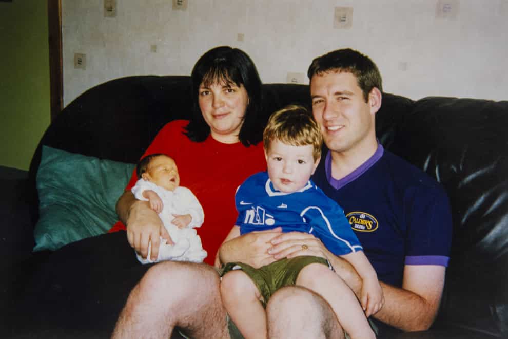 Alistair Wilson, who was shot dead outside his home, with his wife and two children (Police Scotland/PA)