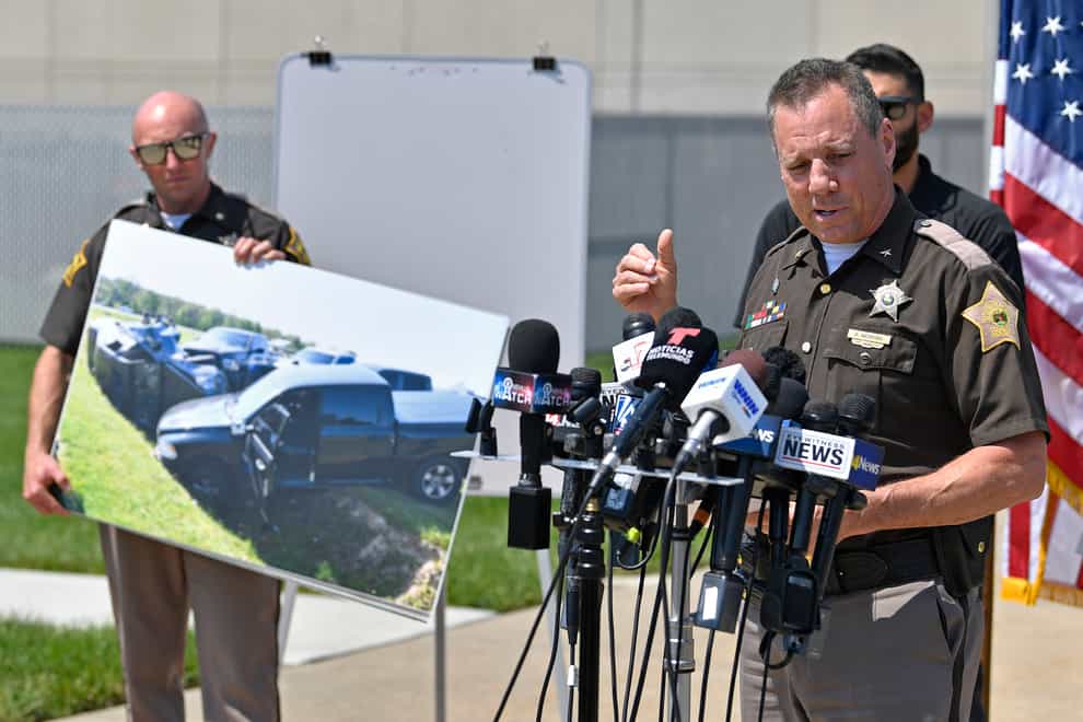 Vanderburgh County sheriff Dave Wedding shows a photograph of the Ford F-150 truck that fugitives Casey White and Vicky White were in when they were captured (Timothy D. Easley/AP)
