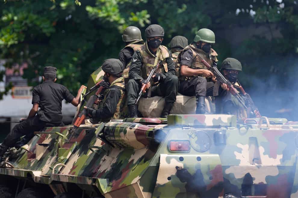 Sri Lankan army soldiers patrol during curfew in Colombo, Sri Lanka (Eranga Jayawardena/AP)