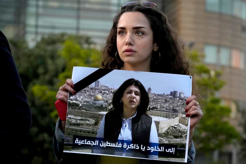 A Lebanese journalist holds a portrait of Al Jazeera journalist Shireen Abu Akleh during a protest in front of United Nations headquarters in Beirut, Lebanon, Wednesday, May 11, 2022. Abu Akleh was shot and killed on Wednesday while covering an Israeli military raid in the occupied West Bank. The broadcaster and two reporters who were with her blamed Israeli forces. (AP Photo/Bilal Hussein)