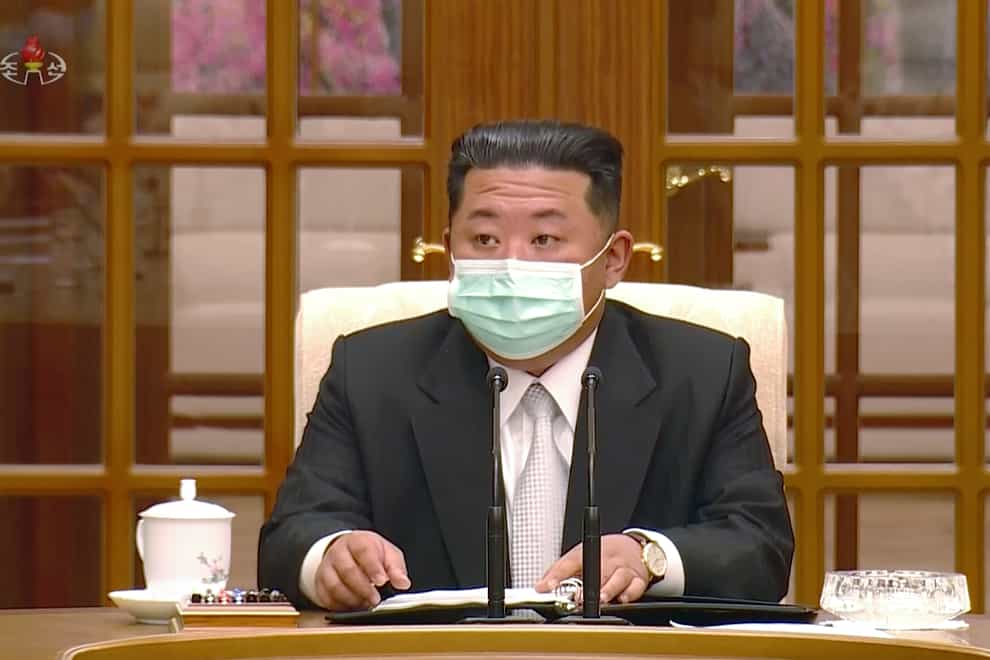North Korean leader Kim Jong Un wears a face mask on state television (KRT/AP)