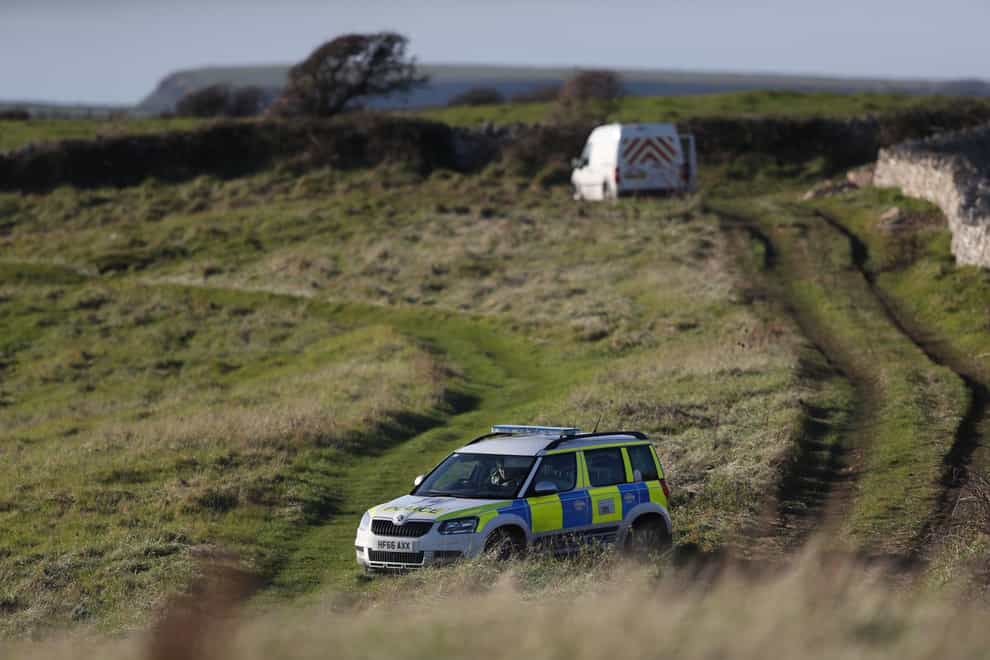 Police activity on a coastal path near Swanage, Dorset, after a body was discovered in the hunt for the missing 19-year-old Gaia Pope-Sutherland (Andrew Matthews/PA)