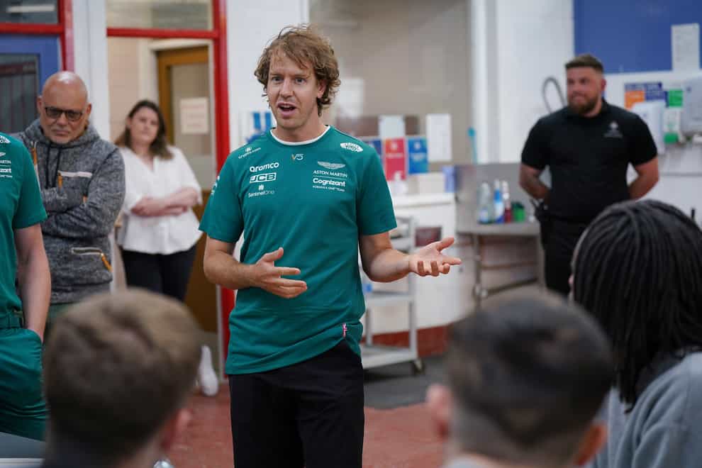 Formula 1 driver Sebastian Vettel meets young offenders during a visit to HMP Feltham (Yui Mok/PA)