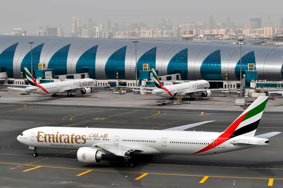 An Emirates plane taxis to a gate at Dubai International Airport (Adam Schreck/AP)