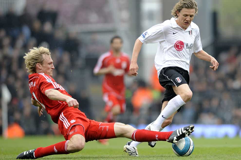 Fulham’s Jimmy Bullard (r) and Liverpool’s Sami Hyypia (l) battle for the ball (PA)
