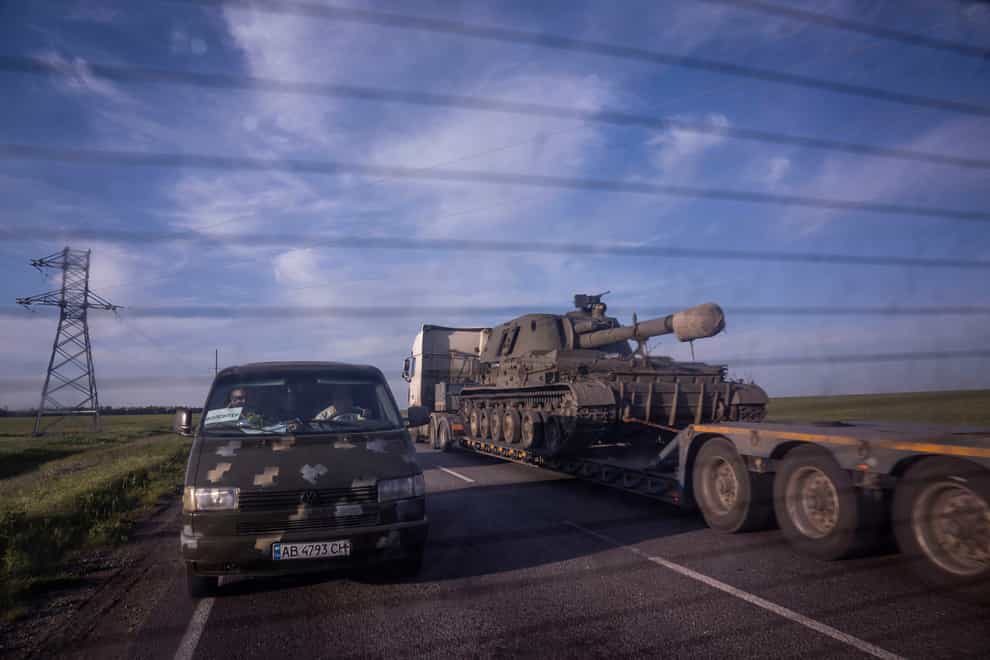 A truck transports a platform with a Ukrainian self-propelled artillery vehicle in the Donetsk region of Ukraine on Thursday May 12 2022 (Evgeniy Maloletka/AP)