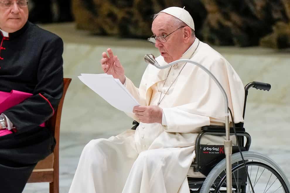 Pope Francis in a wheelchair delivers his address during an audience with members of the Italian Civil Aviation Authority in the Paul VI Hall at The Vatican on Friday May 13 2022 (Andrew Medichini/AP)