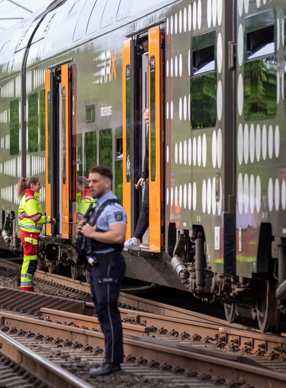 Police officers standing in front of a regional train in Herzogenrath, Germany (Ralf Roeger/dpa/AP)