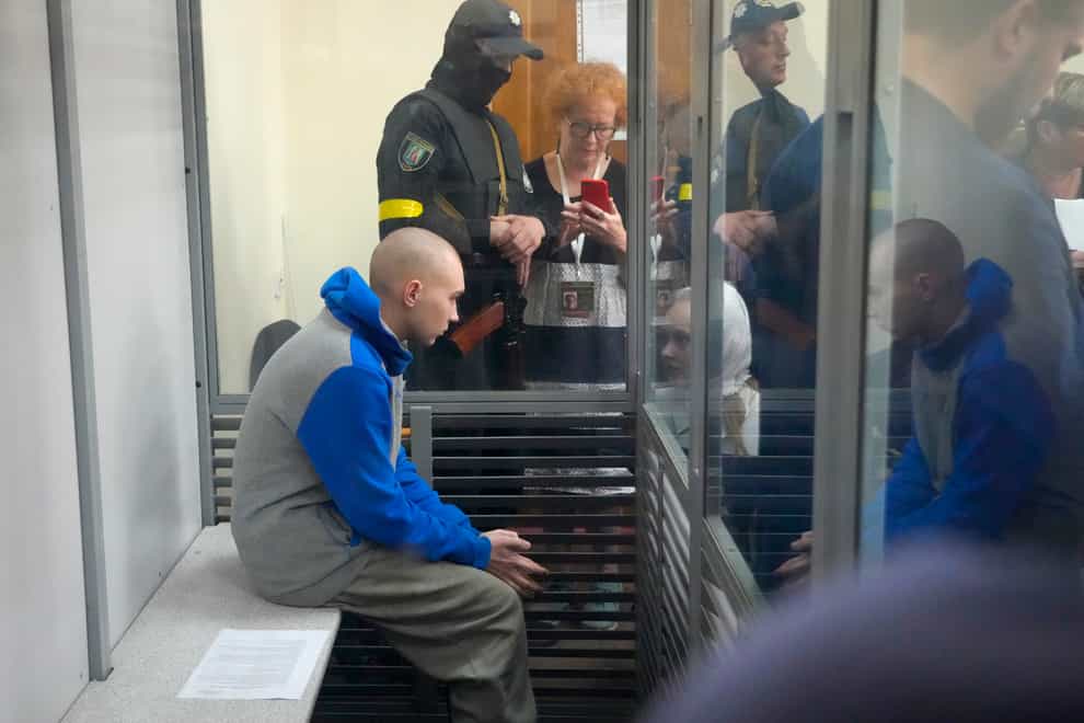 Russian sergeant Vadim Shishimarin, 21, is seen behind glass during a court hearing in Kyiv, Ukraine, on Friday May 13 2022 (Efrem Lukatsky/AP)